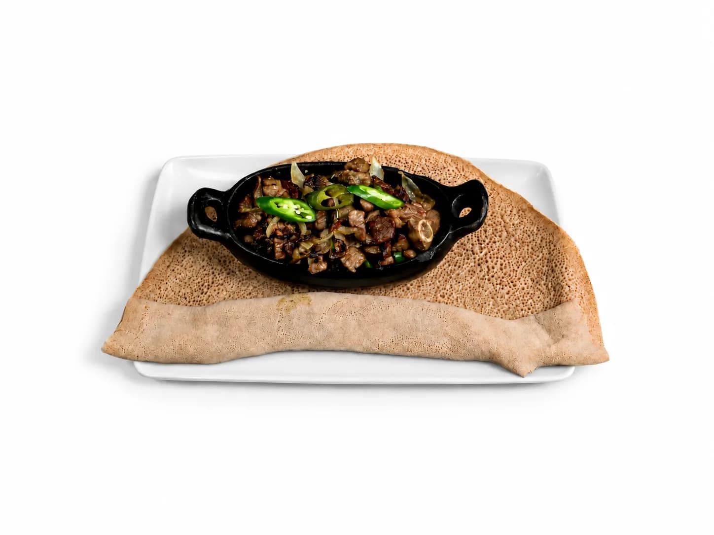Geba Weta with sauteed meat, green chilli and injera