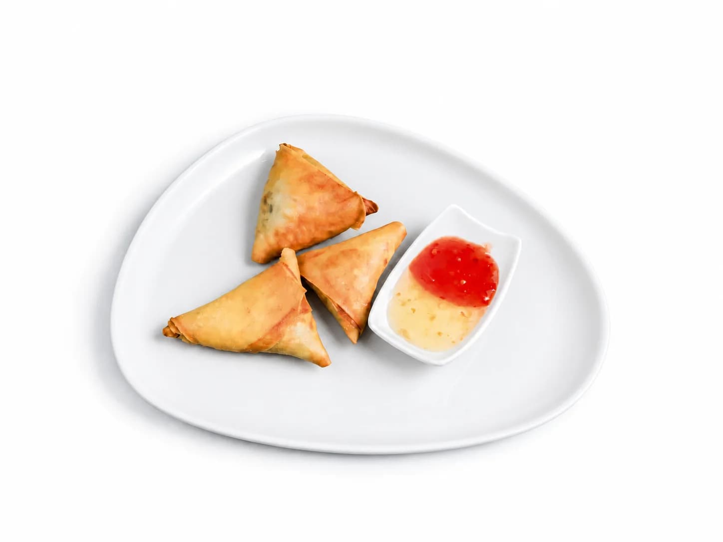 Golden Sambusa with two dips on a white plate